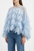 Blusa azzurra in organza con balze scenografiche